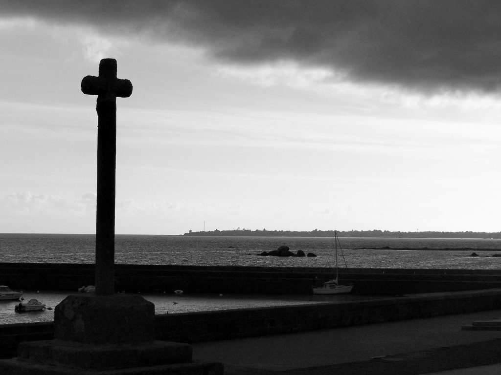a cross facing the sea